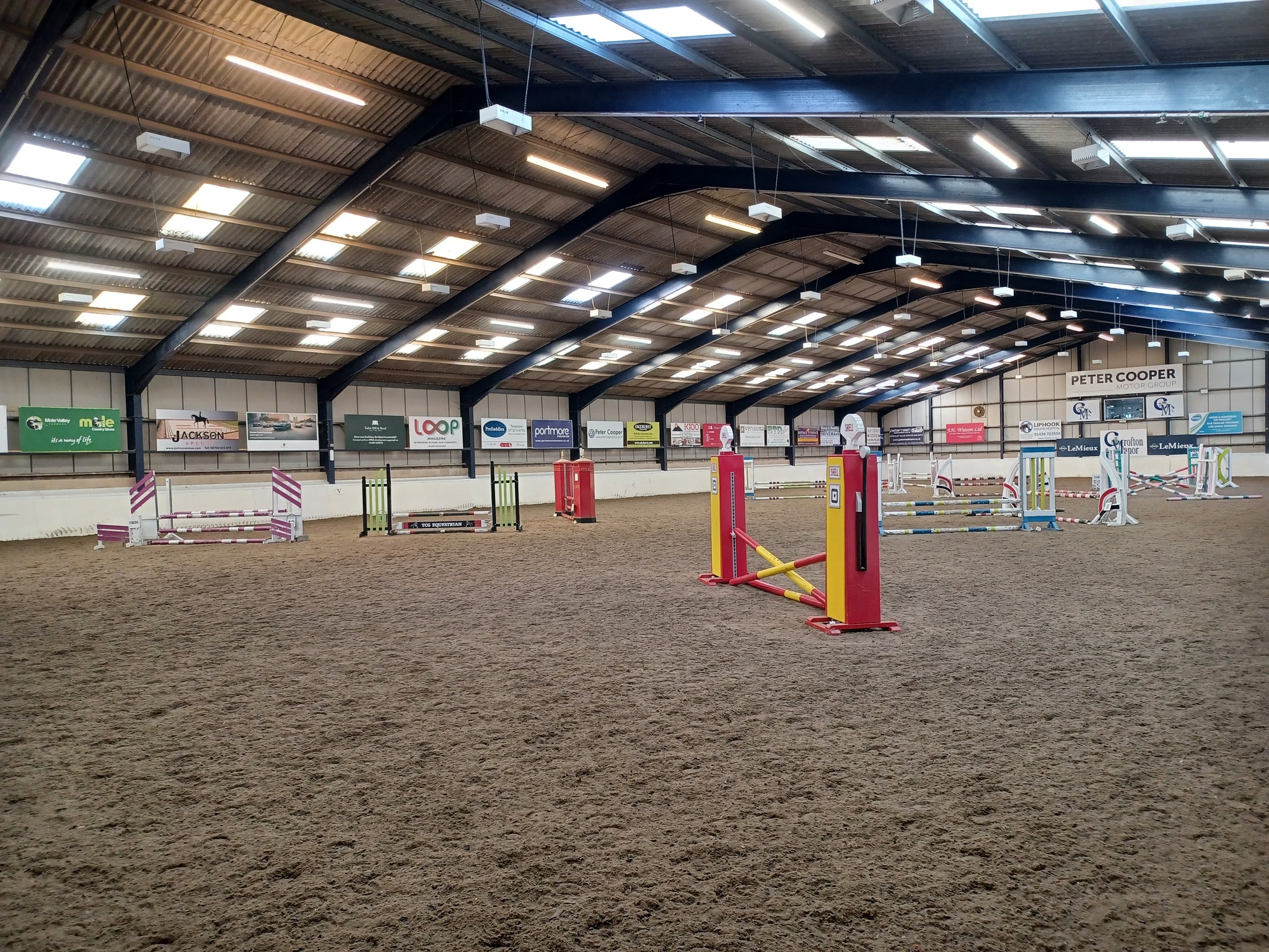 Indoor school with show jumps at Crofton
